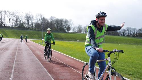 Man cycling on an athletics track at Thornes Park Stadium, Wakefield